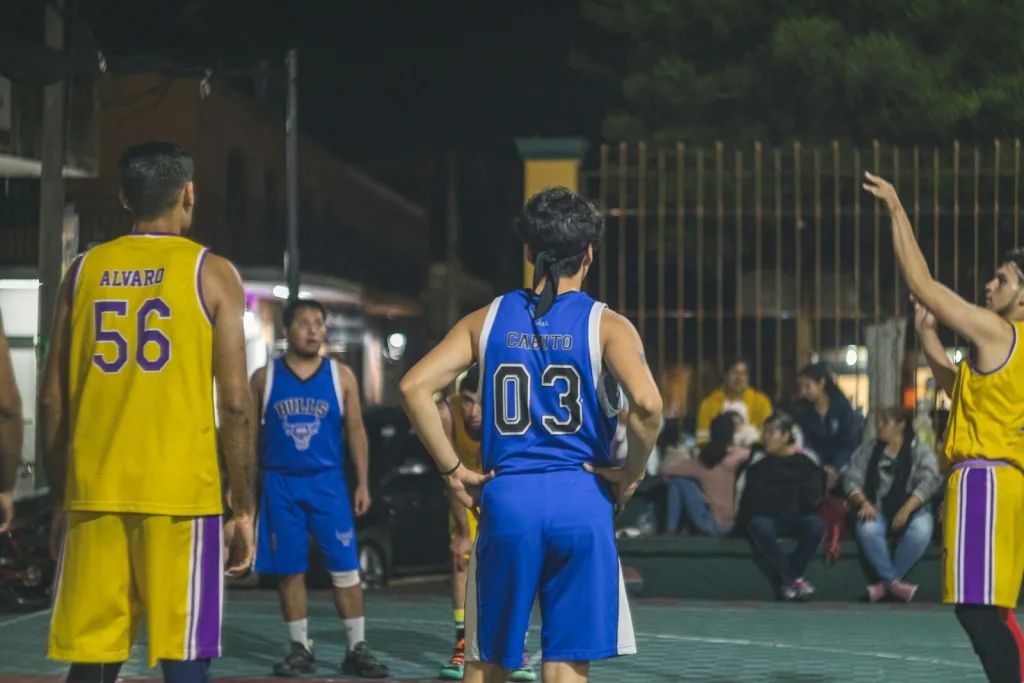 a group of men in sports uniforms