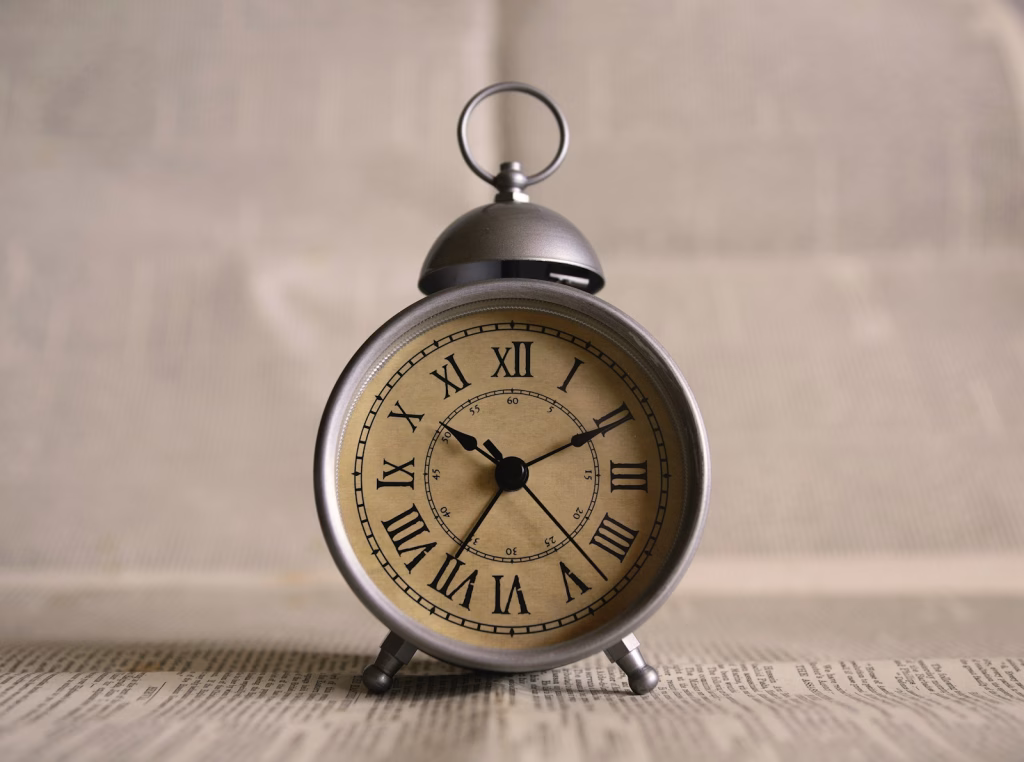 turned on gray alarm clock displaying 10:11