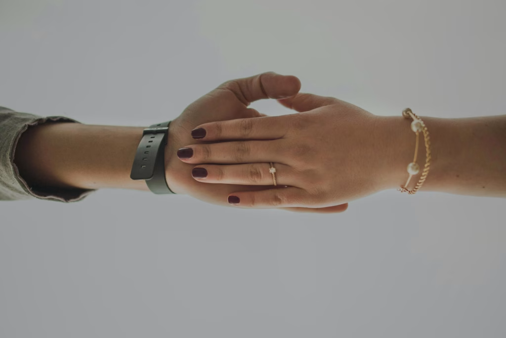 a couple of people that are holding hands