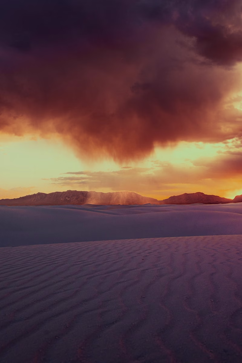 Dramatic sunset over a vast desert landscape